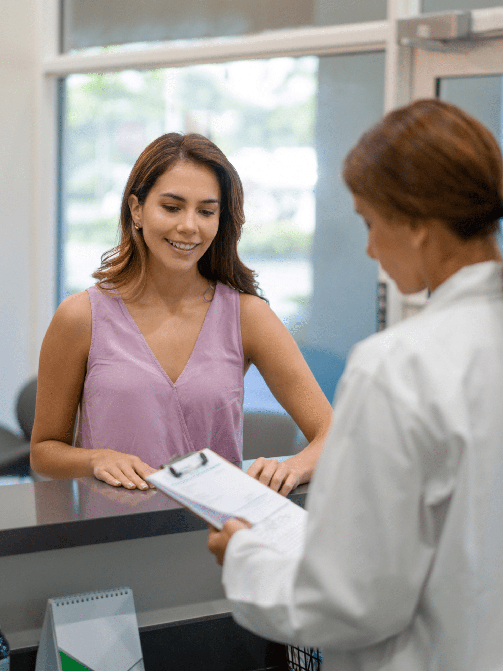 Woman at Front Desk in Dentist Office