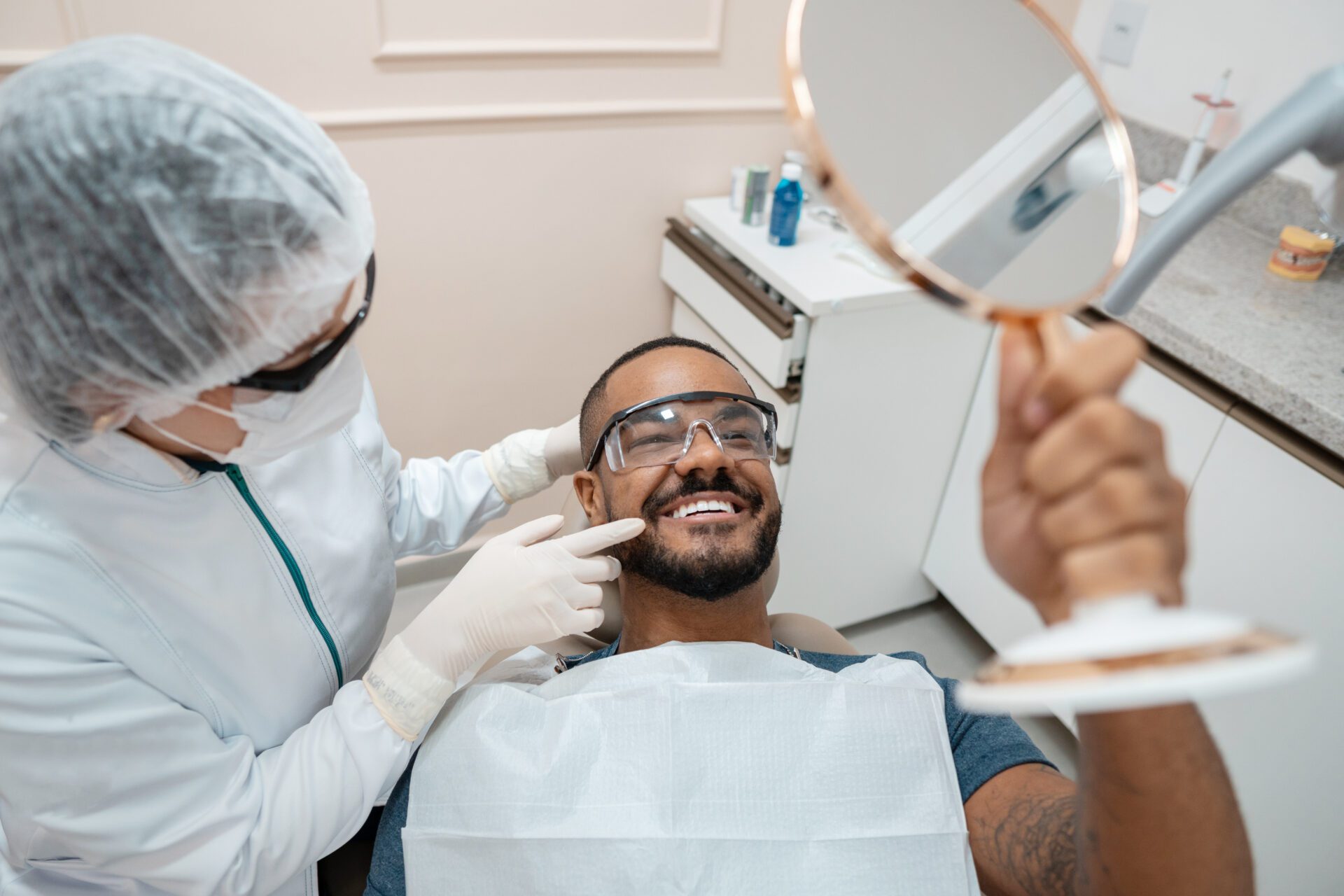 Smiling Man with Dentist and Mirror