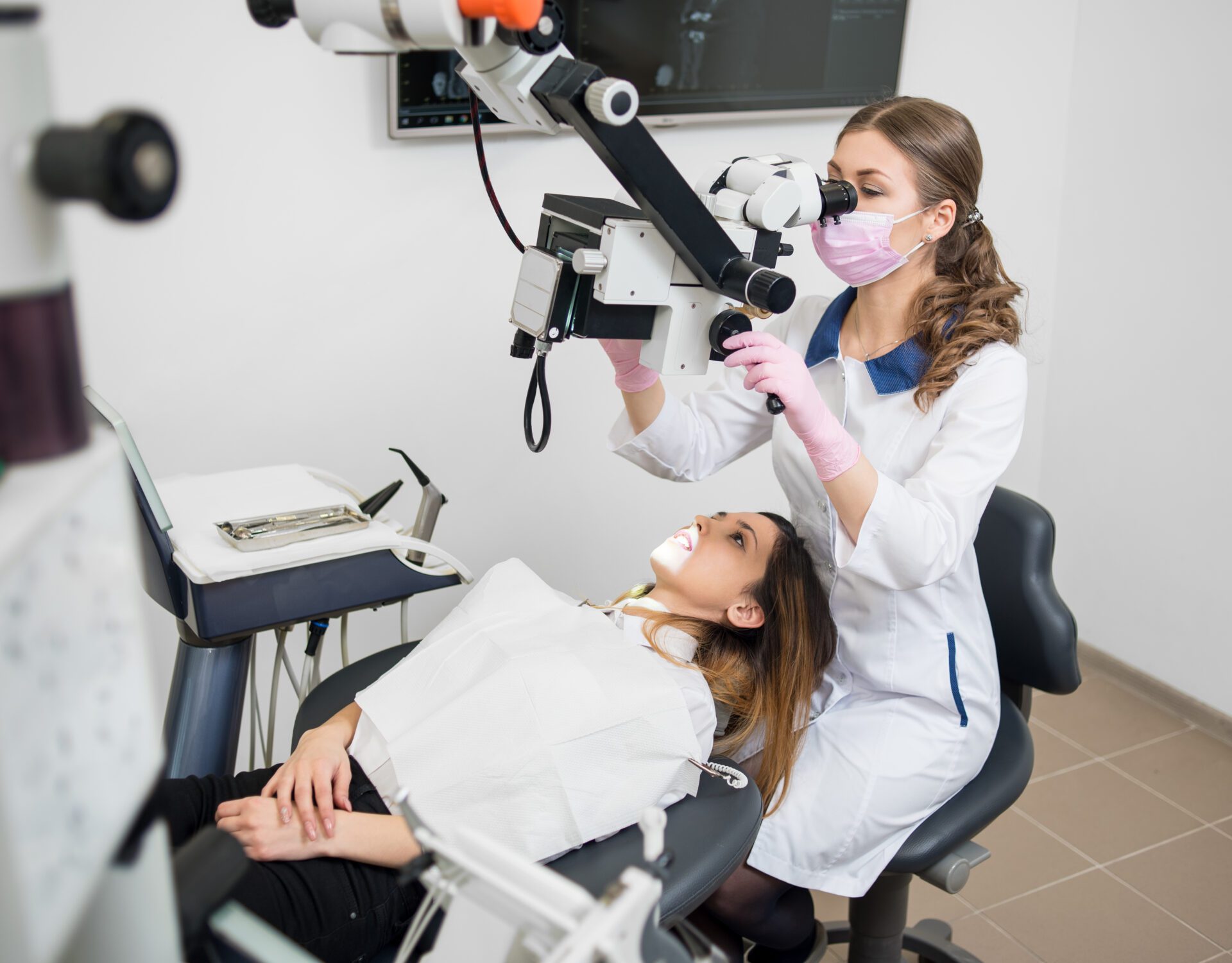 Dentist Looking at Teeth with a Microscope | Smiles on Florida